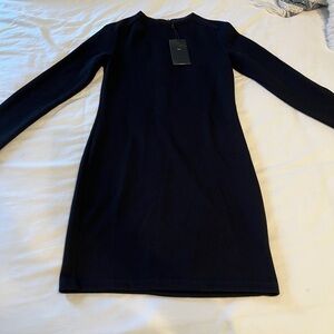 Zara long sleeved black knit form fitting dress. Never worn.